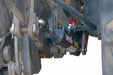 Close-up of a mechanical component on a vehicle.
