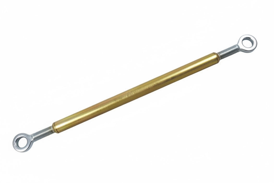 Gold metal rod with eye bolts on a white background