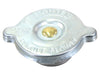 Metal radiator cap with engraved text on a white background