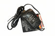 Black battery charger with cable on a metallic surface