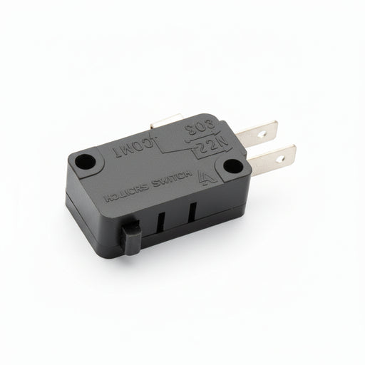 Microswitch on a wooden surface with visible wiring.