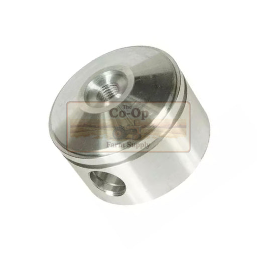 A machined metal cylindrical component with a threaded hole on top and a slot on the side, shown on a white background with a semi-transparent 'The Co-Op Farm Supply' watermark overlay.