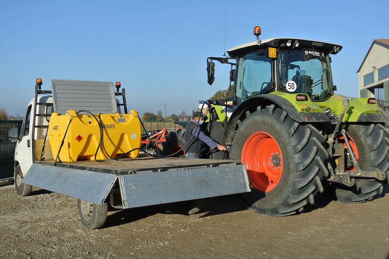 Refueling a tractor with Emiliana Sorbatoi fuel cell on back of vehicle