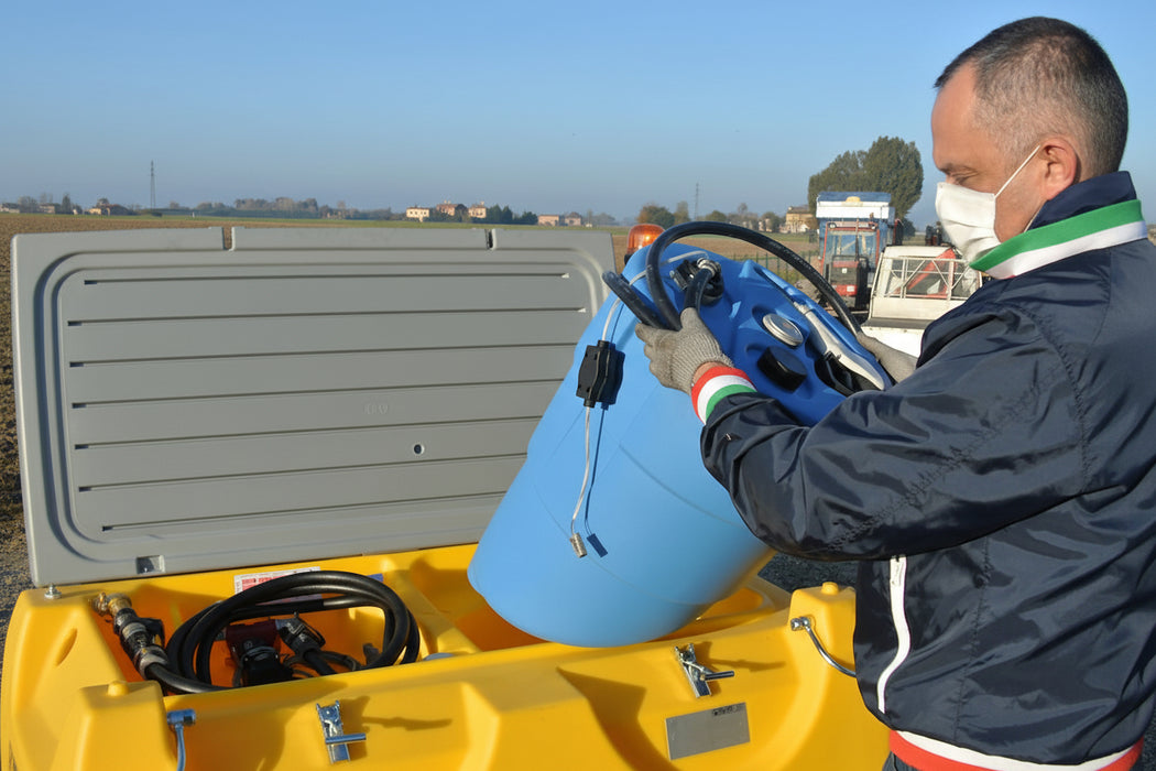 Person using a adblue tank on a yellow diesel pod with 'Emiliana Sebatoi' branding.