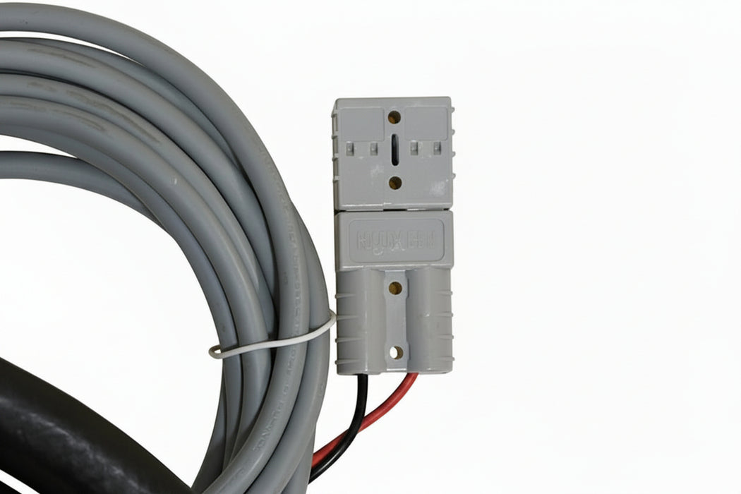 Gray electrical cable and connector on a yellow background