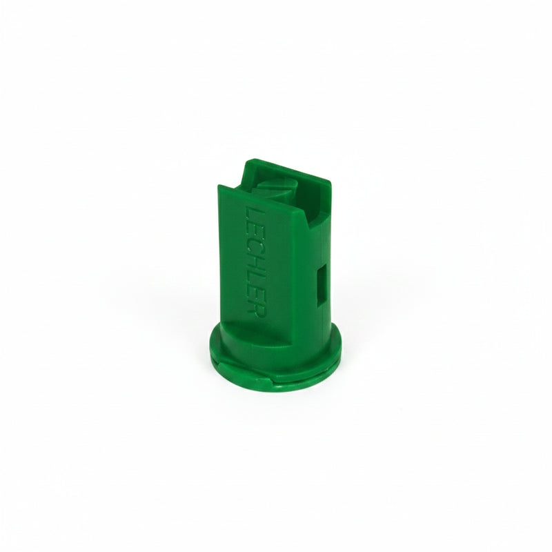 Green plastic component on a white background