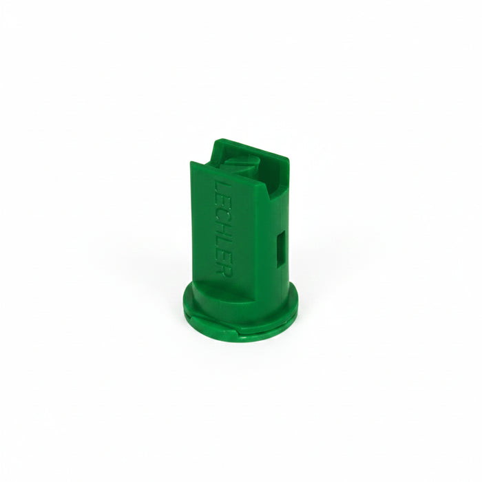 Green plastic component on a white background
