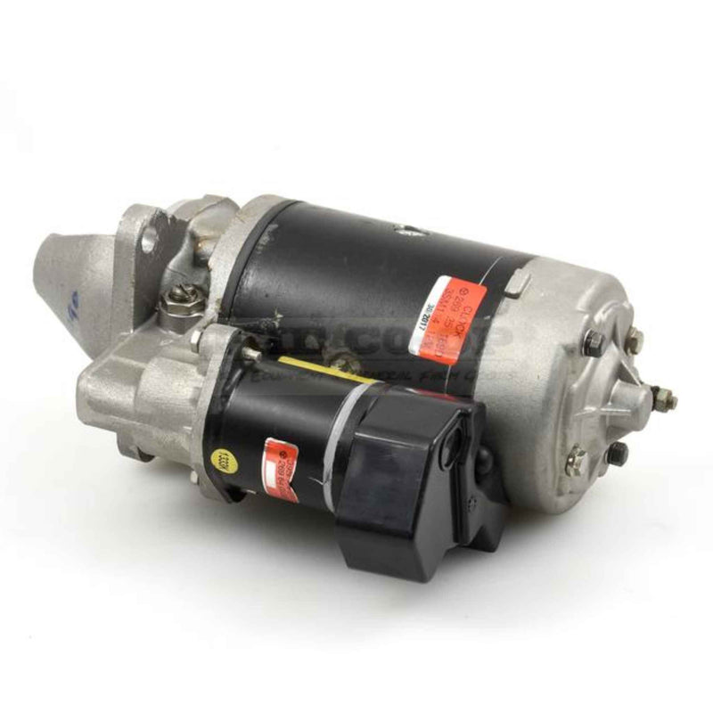 Tractor starter motor on a white background