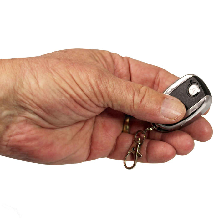 Hand holding remote control Silvan rechargeable sprayer