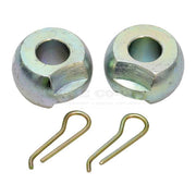 Two metal bushings and two spring clips on a white background