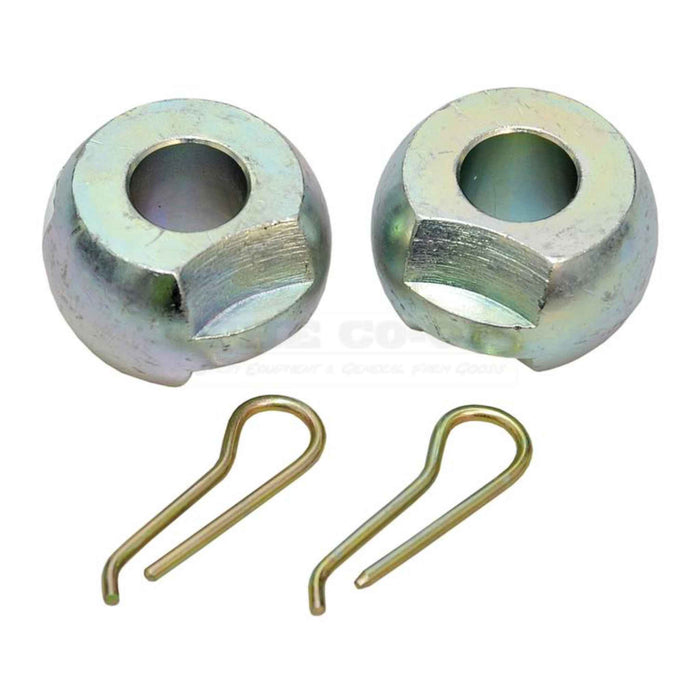 Two metal bushings and two spring clips on a white background